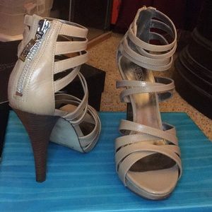 Tan strappy heels.